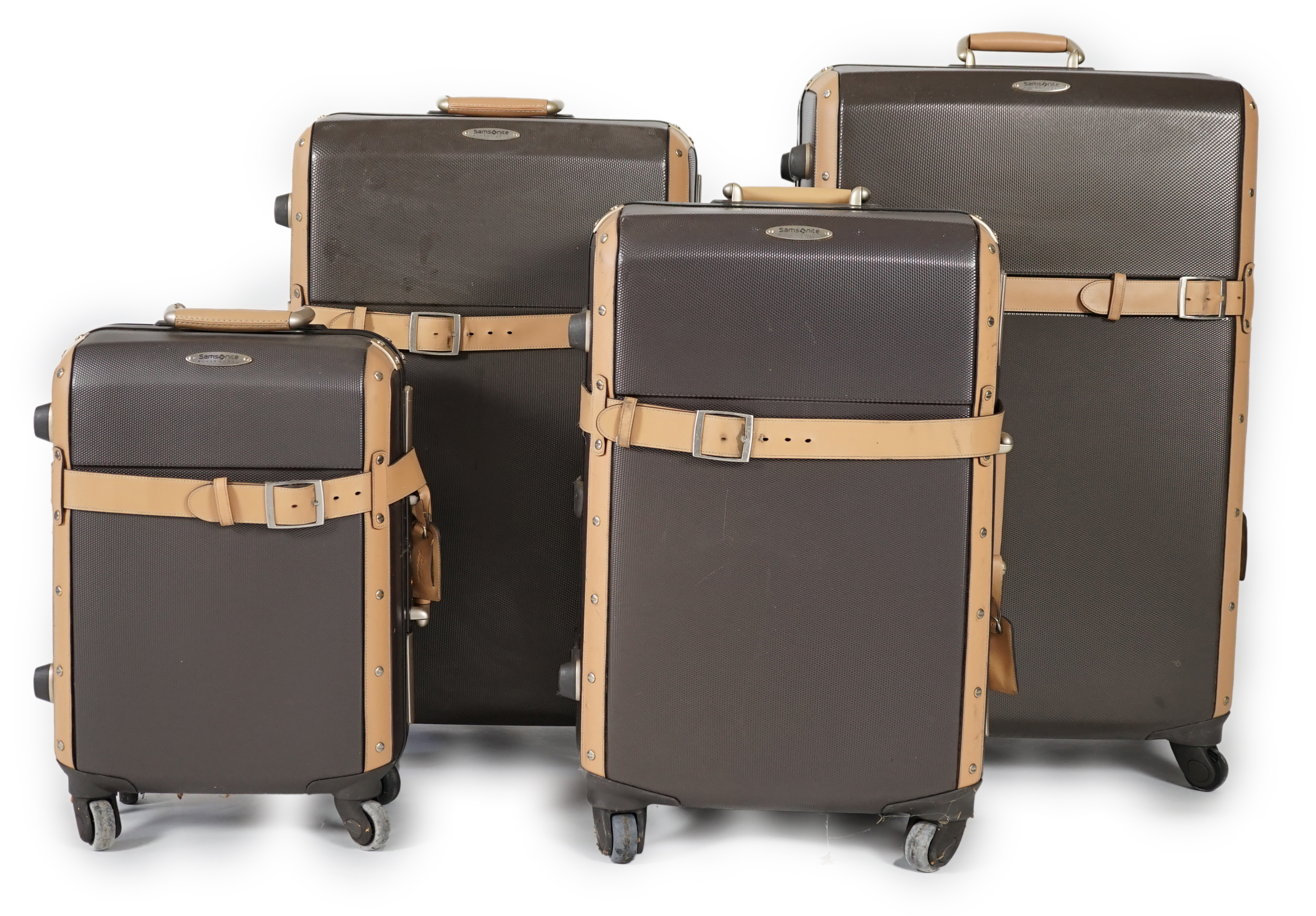 A graduated set of four Samsonite Black Label brown and tan hard suitcases, 83cm x 52cm x 34cm, 77cm x 48cm x 30cm, 66cm x 43cm x 27cm, 53cm x 36cm x 22cm